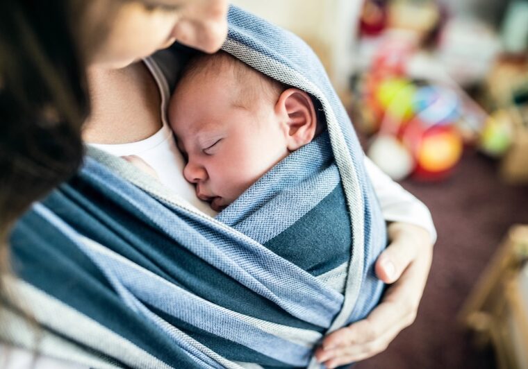 new mom with baby in sling