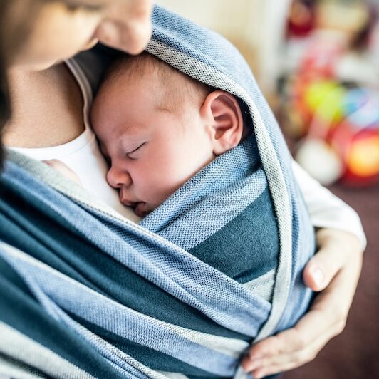 new mom with baby in sling